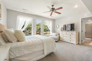 Bedroom with a ceiling fan, access to exterior, light colored carpet, and recessed lighting