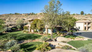 Obstructed view of property with a front yard and stucco siding