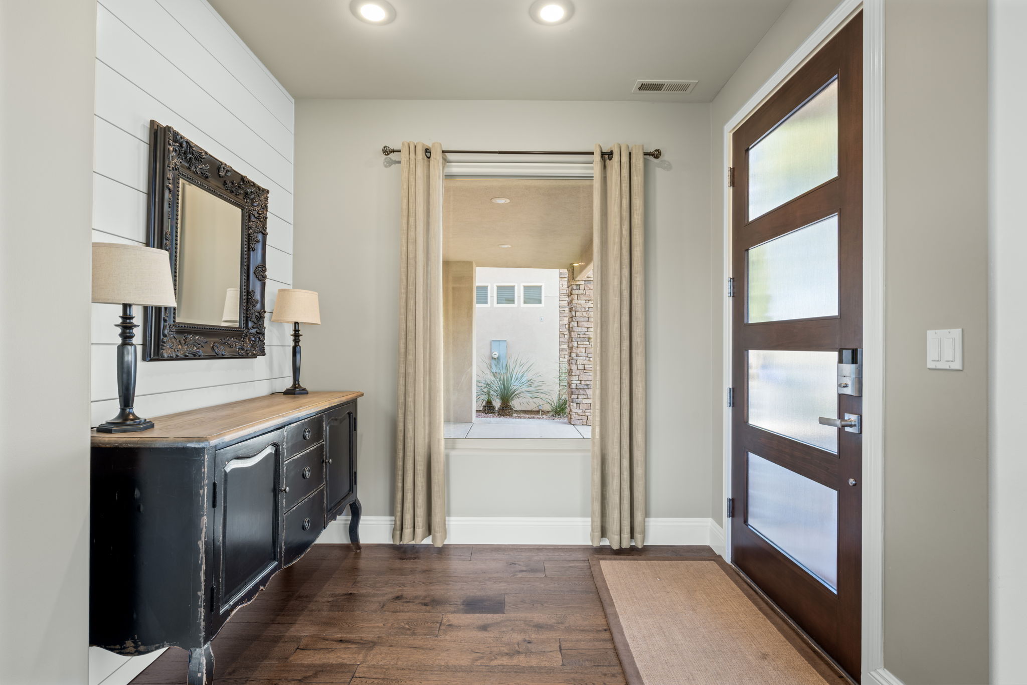 Entryway with hardwood / wood-style floors and recessed lighting