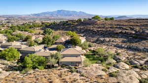 Aerial perspective of suburban area with a mountainous background