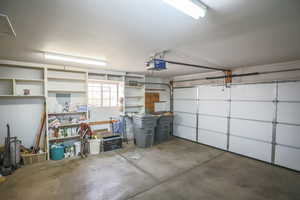 Garage featuring a garage door opener