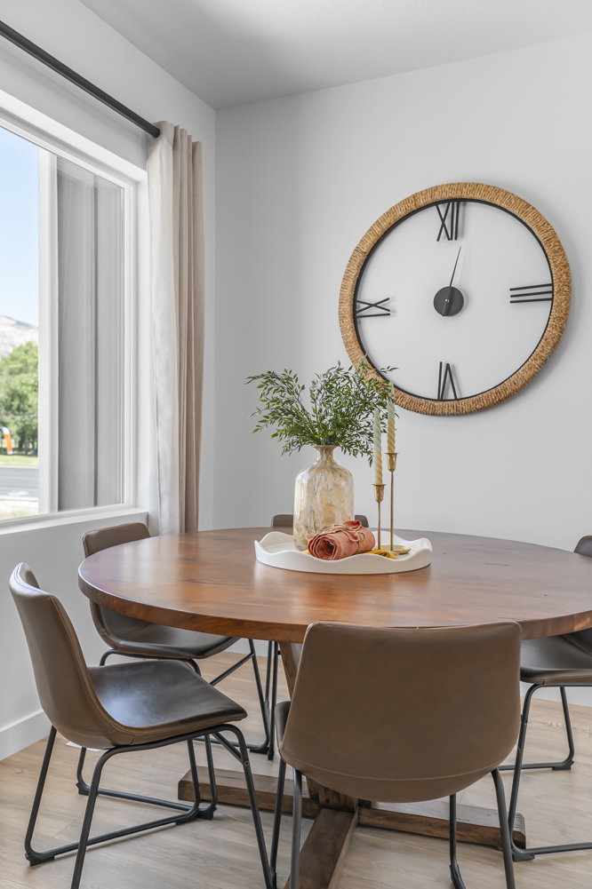 Dining room with light wood-style flooring and baseboards