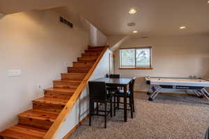 Stairway featuring carpet and recessed lighting