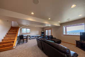 Living room featuring light colored carpet and recessed lighting