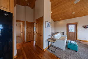 Foyer entrance with a vaulted wood ceiling, hardwood / wood-style flooring, plenty of natural light, and recessed lighting