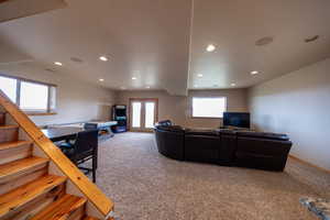 Living area featuring light colored carpet, recessed lighting, and an office area