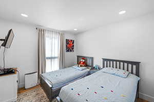 Bedroom featuring recessed lighting and wood finished floors