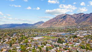 Aerial view of residential area with a mountainous background