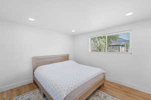Bedroom featuring light wood-style flooring and recessed lighting
