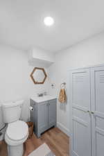 Bathroom with vanity and light wood-type flooring