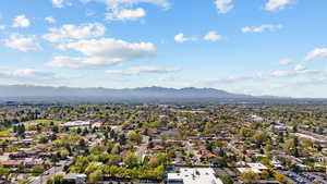 Aerial view of residential area featuring a mountain backdrop