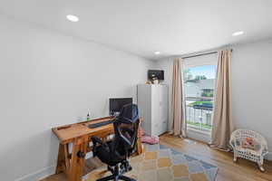 Office featuring light wood-style floors and recessed lighting