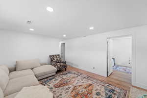 Living room featuring light wood-style floors and recessed lighting