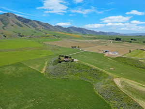 Aerial view of sparsely populated area featuring a mountain backdrop