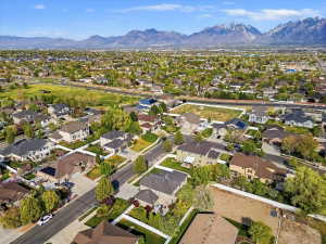 Aerial view of residential area featuring a mountain backdrop