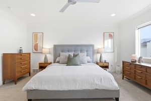 Bedroom featuring light carpet, a ceiling fan, ornamental molding, and recessed lighting