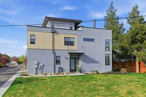 Contemporary home featuring stucco siding
