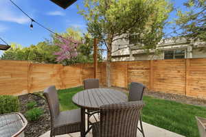 Fenced backyard featuring a patio and outdoor dining space