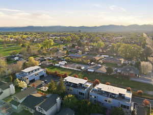 Aerial perspective of suburban area with a mountain backdrop