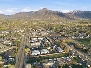 Aerial perspective of suburban area featuring a mountain backdrop