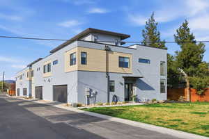 View of building exterior with an attached garage
