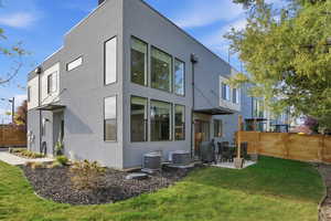 Rear view of property featuring stucco siding and a patio area