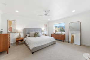 Bedroom with crown molding, light colored carpet, a ceiling fan, and recessed lighting