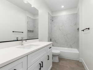 Full bath featuring vanity, bathing tub / shower combination, and recessed lighting