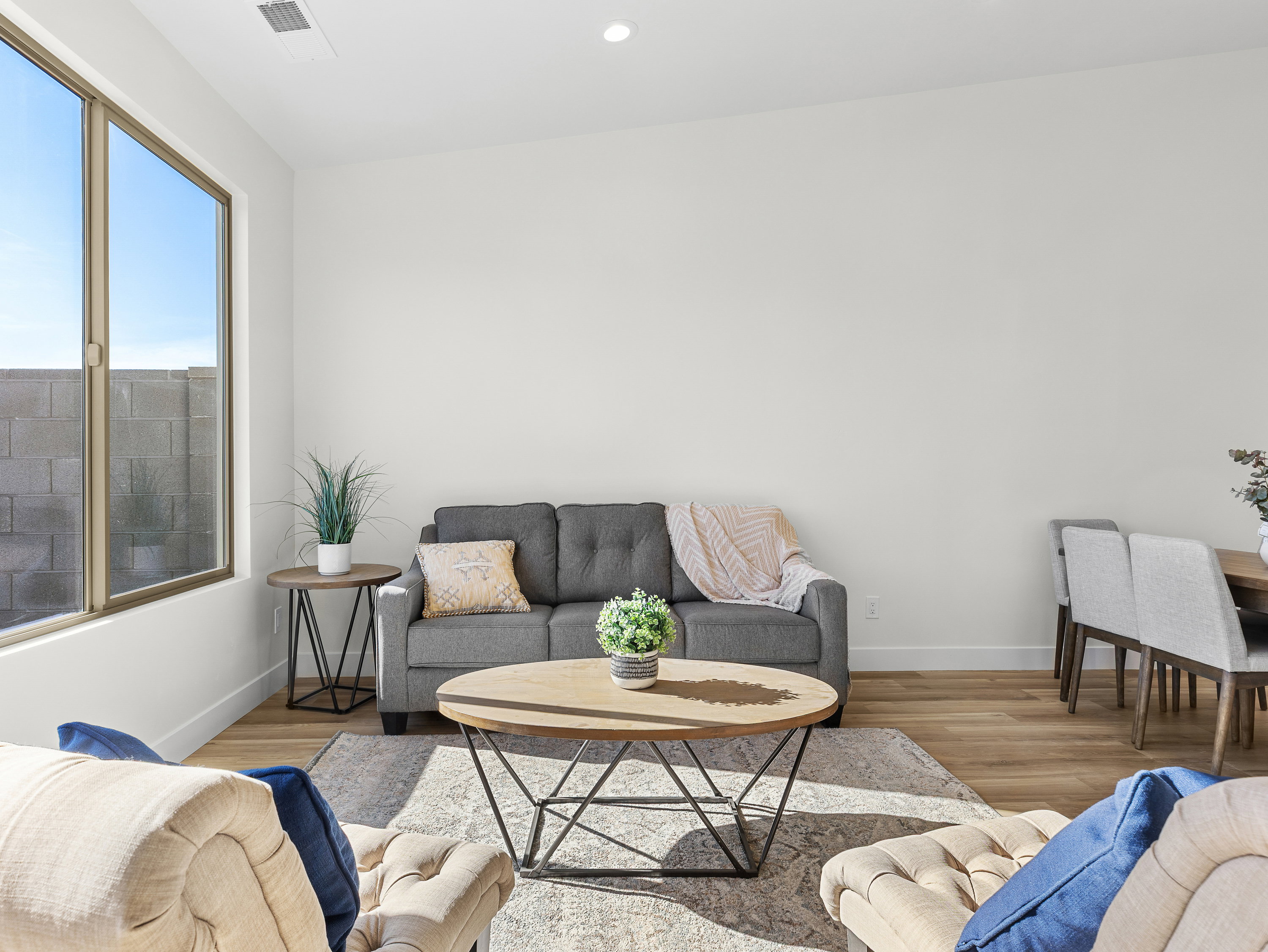 Living room with wood finished floors and recessed lighting
