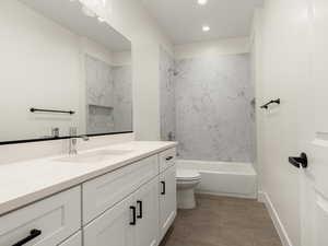 Bathroom with vanity and bathtub / shower combination