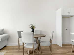 Dining space with light wood finished floors