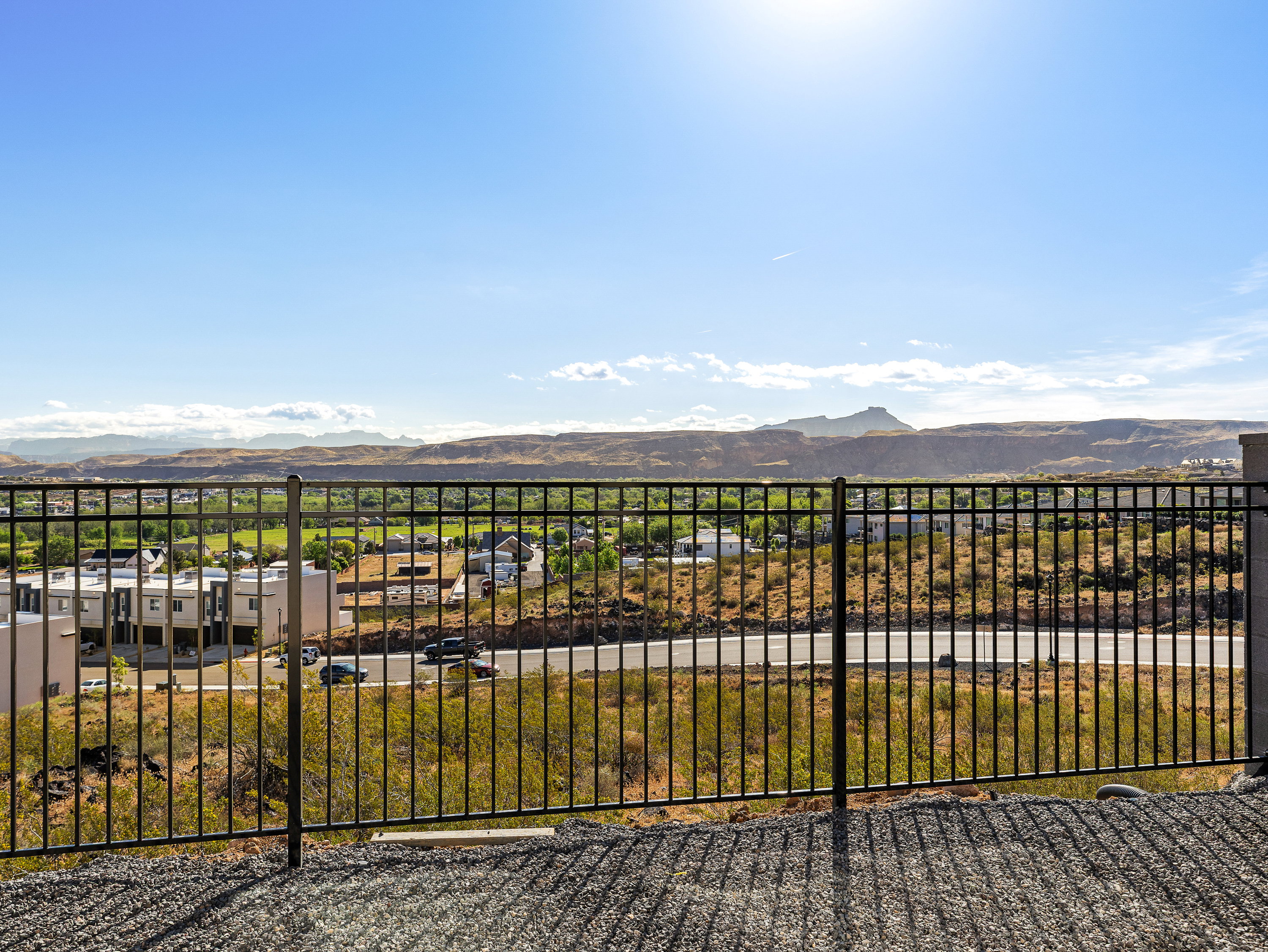View of yard with a mountain view and a balcony