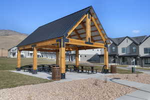 View of home's community featuring a patio area, a mountain view, and a residential view