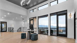 Common area featuring a mountain view, recessed lighting, and a high ceiling