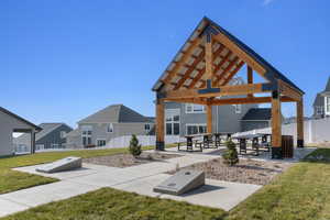 View of property's community with a patio and a residential view