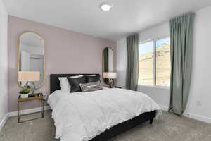 Carpeted bedroom with baseboards