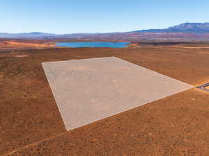 Drone / aerial view of a water and mountain view and a desert landscape