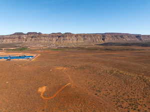 View of rural area with a mountain backdrop and a desert landscape