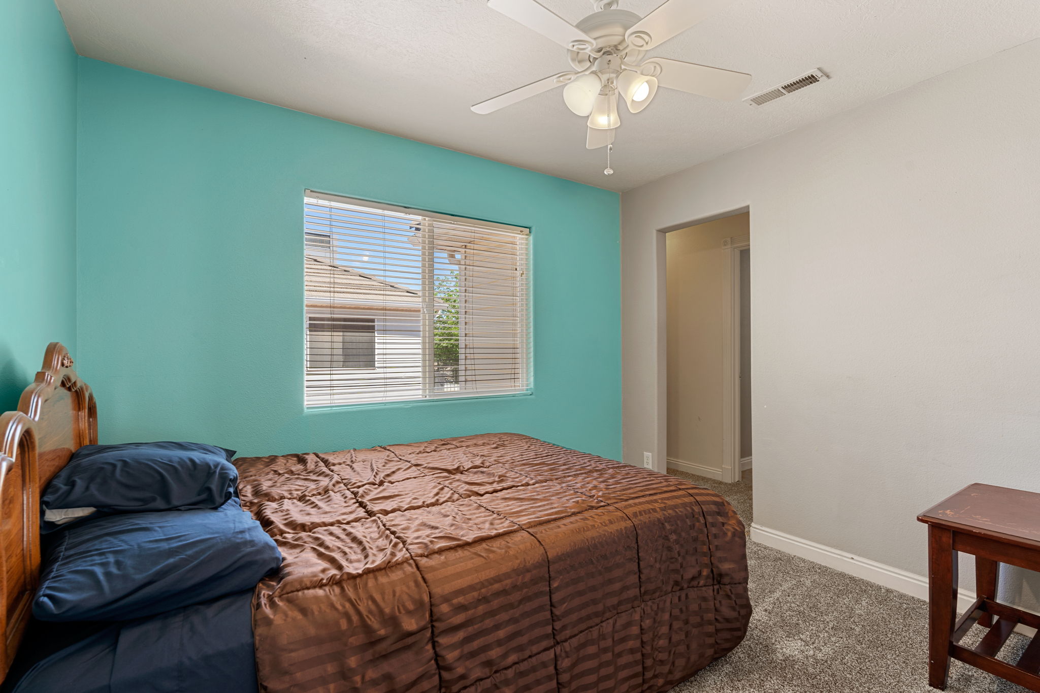 Bedroom with carpet floors and ceiling fan