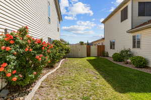 View of yard with a gate