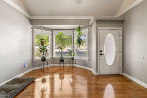 Family room with lofted ceiling and light wood-type flooring