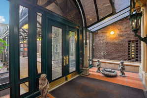 Property entrance featuring french doors