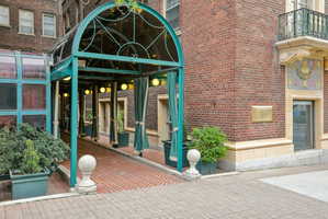 Entrance to property with brick siding and french doors