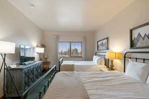 Bedroom featuring a textured wall