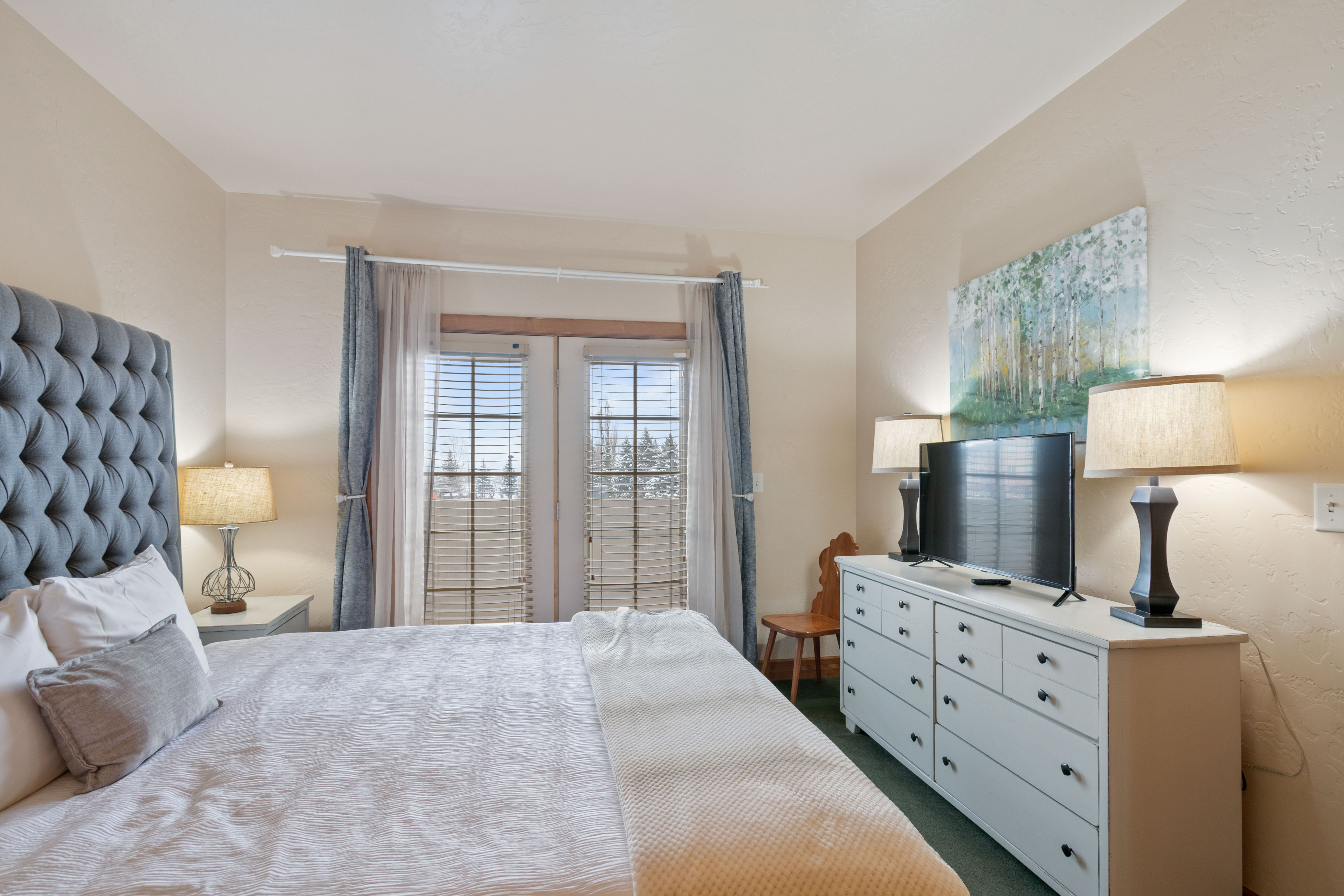 Bedroom featuring dark carpet
