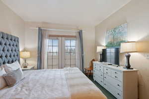 Bedroom featuring dark carpet