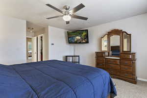 Bedroom featuring ceiling fan and light colored carpet