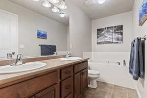 Full bathroom with double vanity  Separate shower and a garden tub