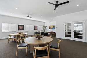 Dining area with french doors, carpet flooring, a ceiling fan, healthy amount of natural light, and recessed lighting
