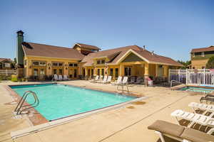 Community pool with a patio area
